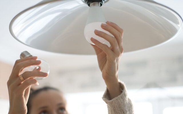 woman changing bulb
